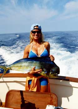 Tara holding a dorado fish